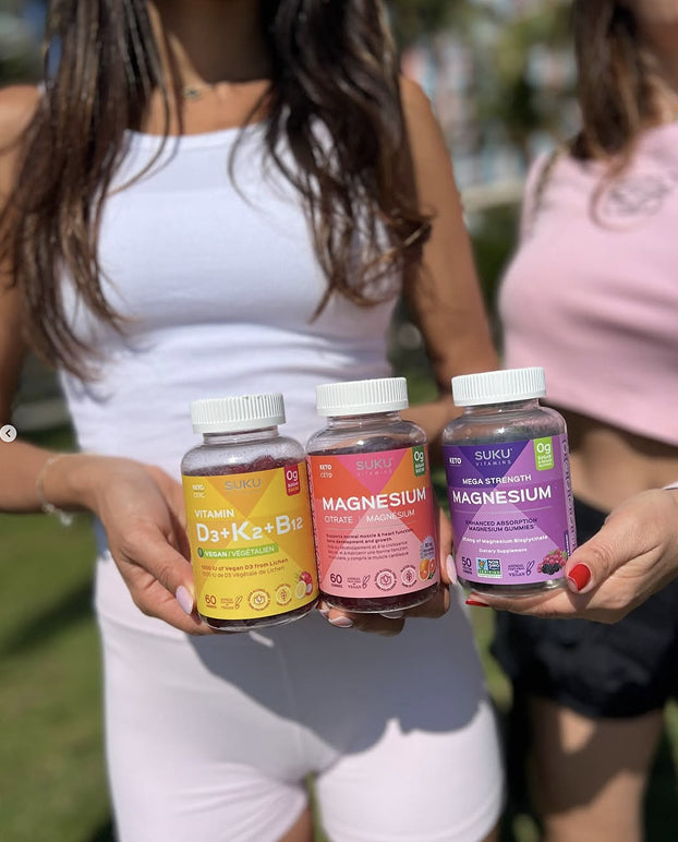 image of women holding suku vitamins