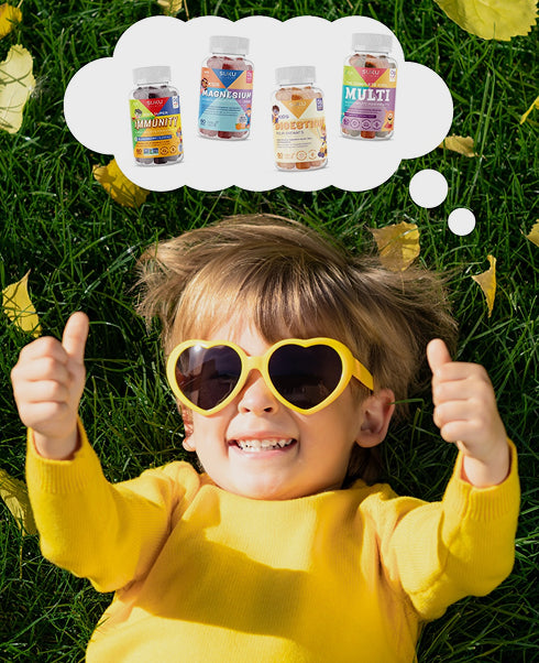 Child wearing sunglasses and giving thumbs up, with thought bubble showing vitamin supplements on grass.