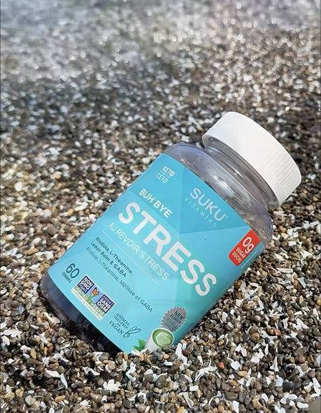 suku stress vitamins on a beach texture