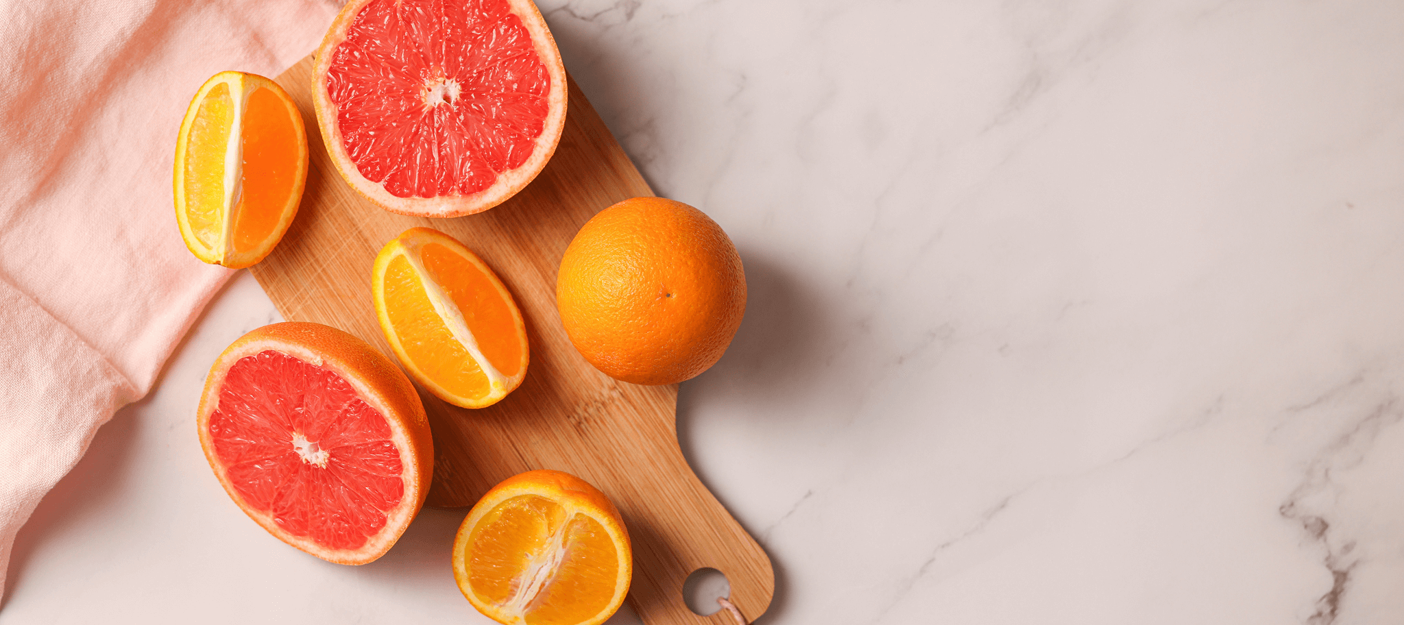 some citrus ingredients on a marble background