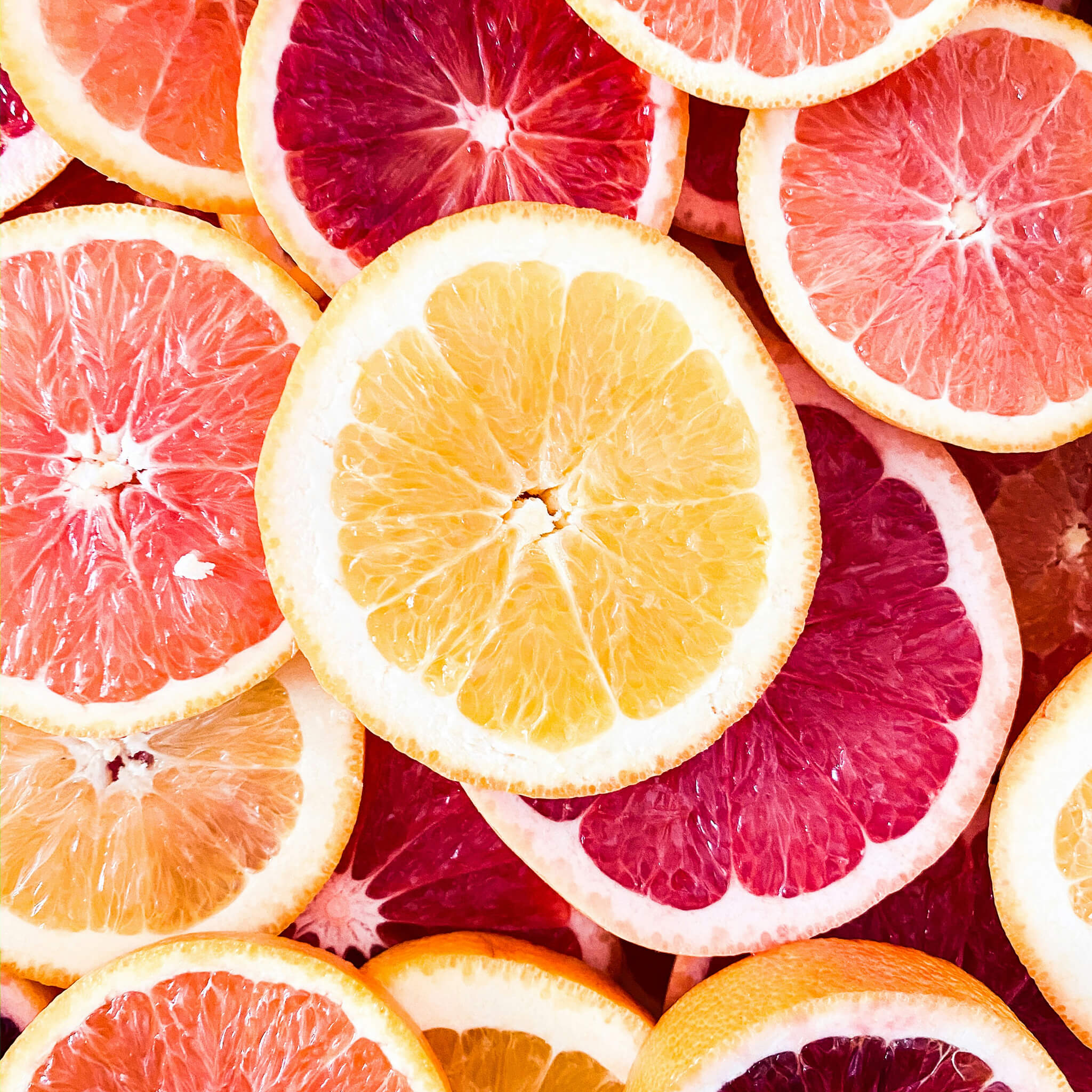 all natural image of citrus on purple background